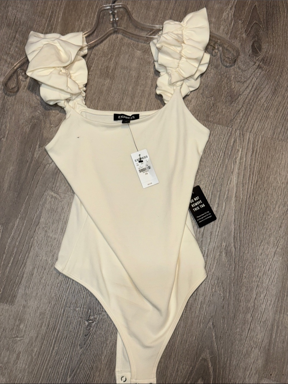 Express Cream Ruffle Strap One-Piece Bodysuit